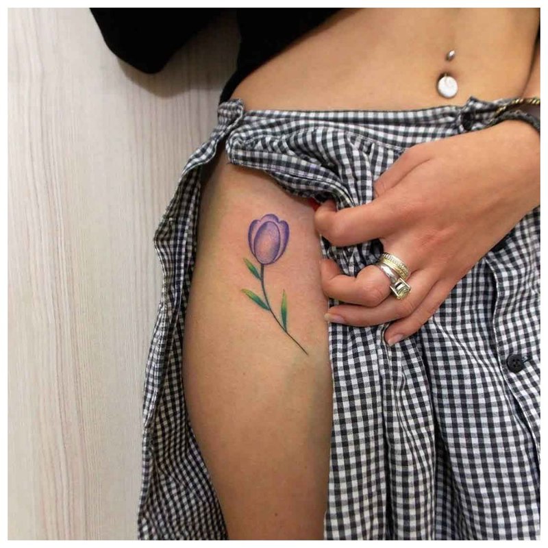 Delicate flower - hip tattoo