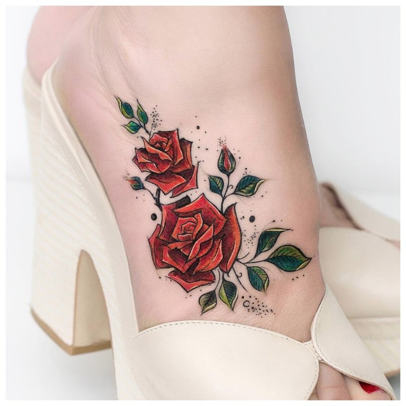 Colored rose tattoo on the foot