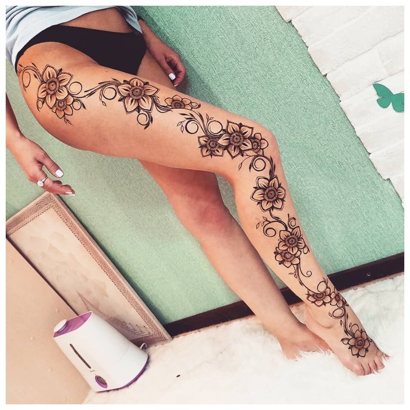 Delicate tattoo on the whole leg