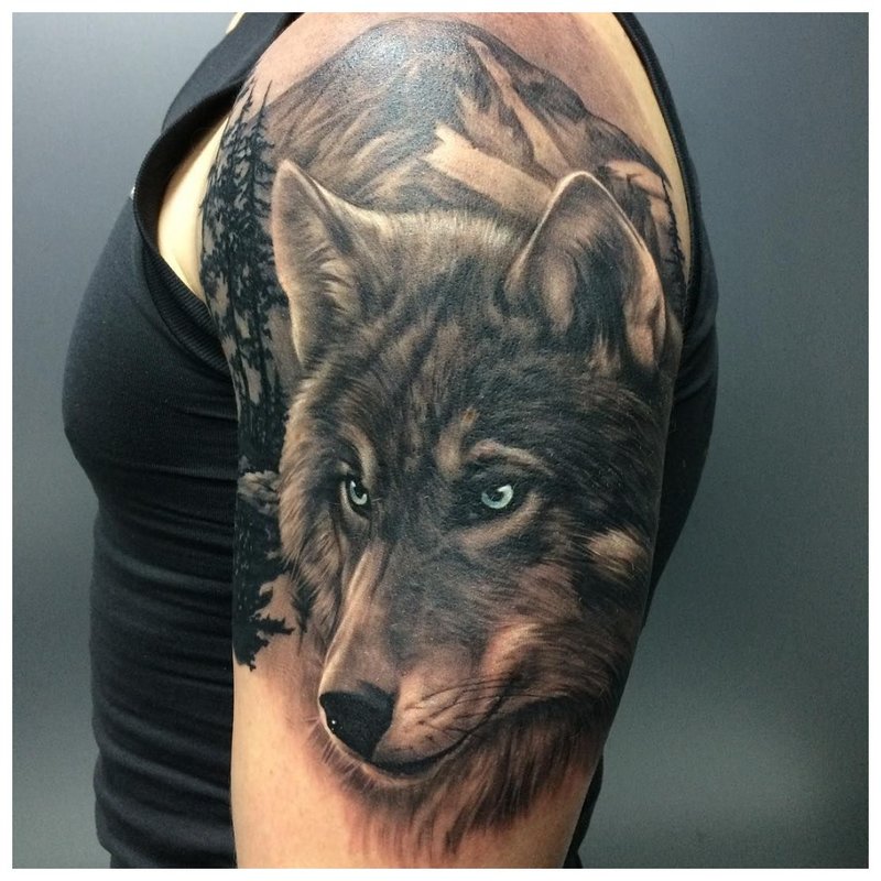 Wolf's eye - tattoo on a man’s shoulder