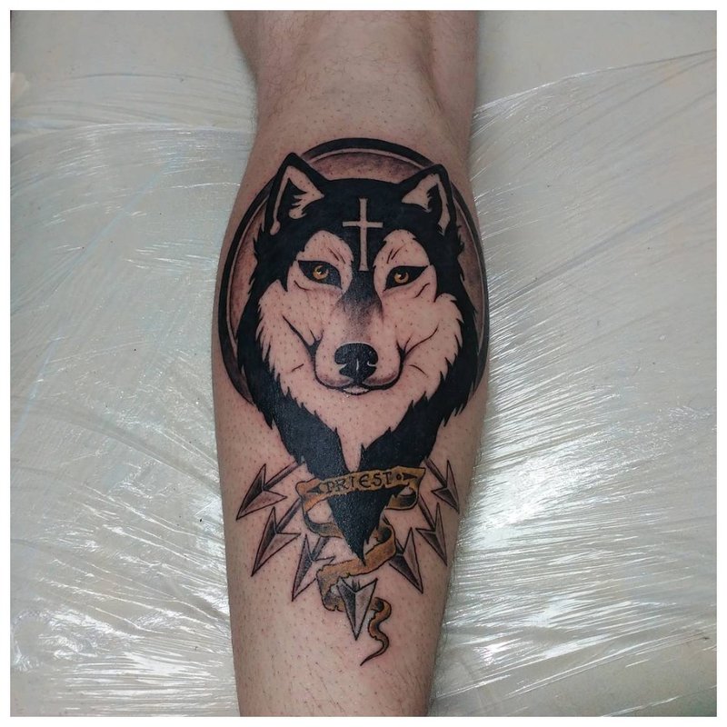 Smiling wolf - calf tattoo