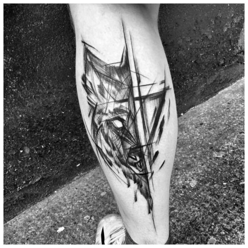 Wolf tattoo on a man's leg