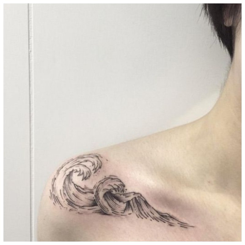 Wave - clavicle tattoo