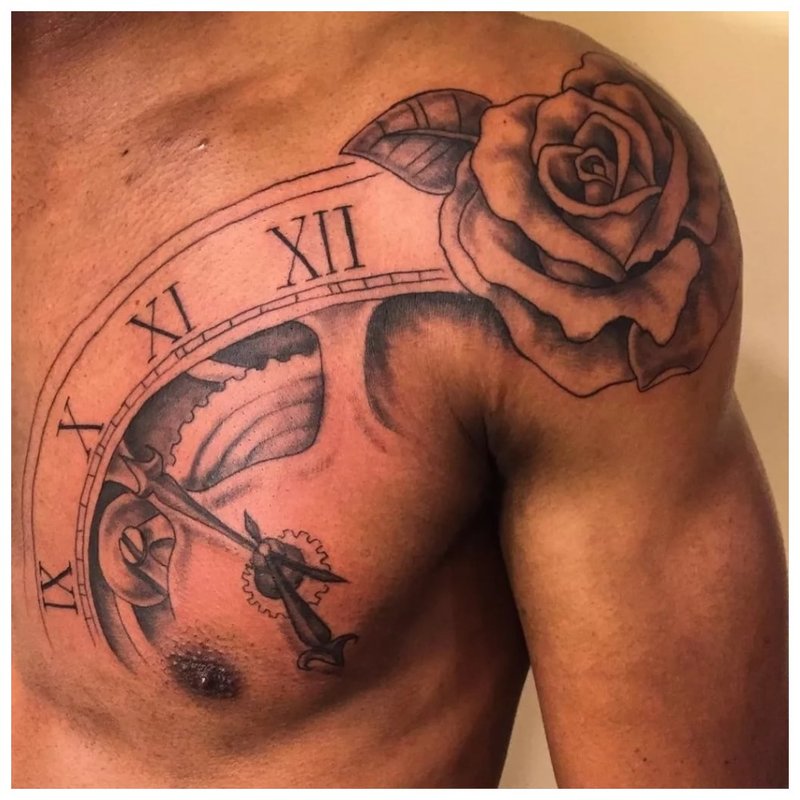 Tattoo with a rose on the shoulder