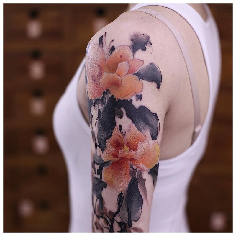 Tattoo in the style of watercolor on the shoulder