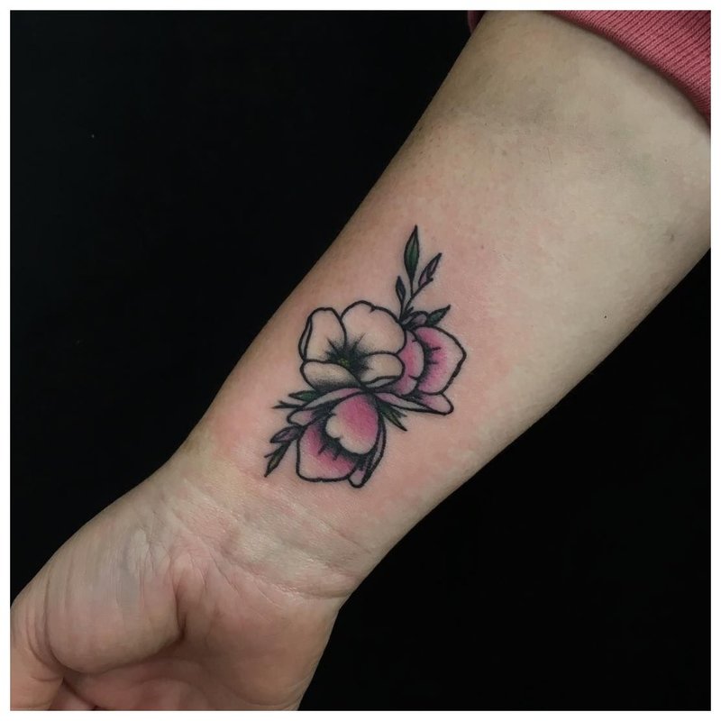 Flower tattoo for a girl on her wrist