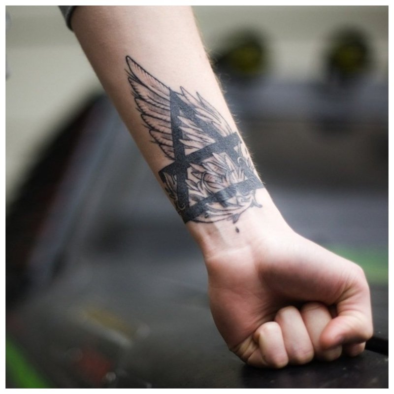 Symbolic tattoo for a man's arm