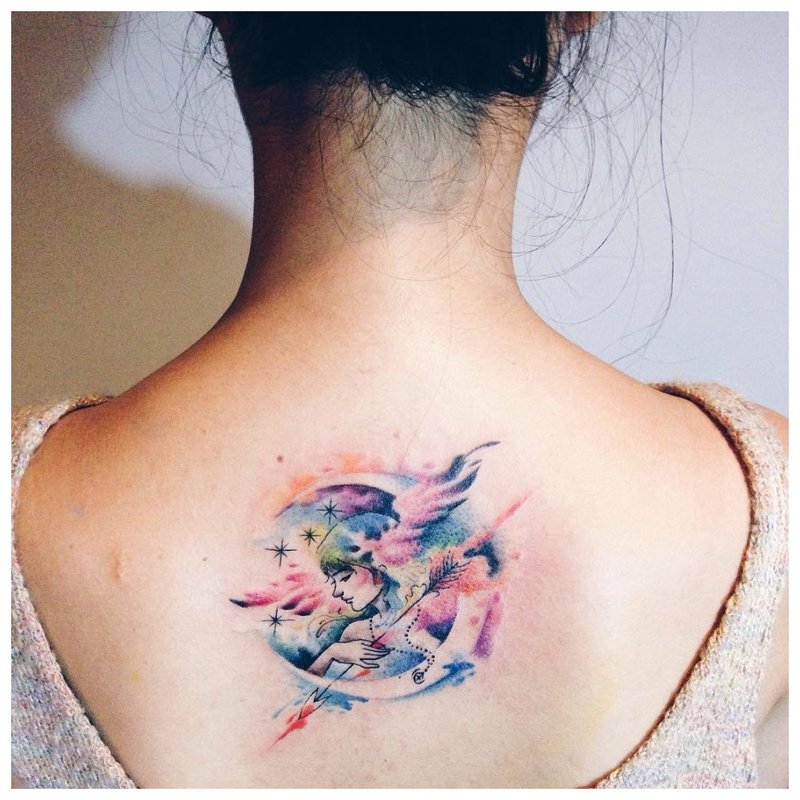 Unusual watercolor tattoo on the back