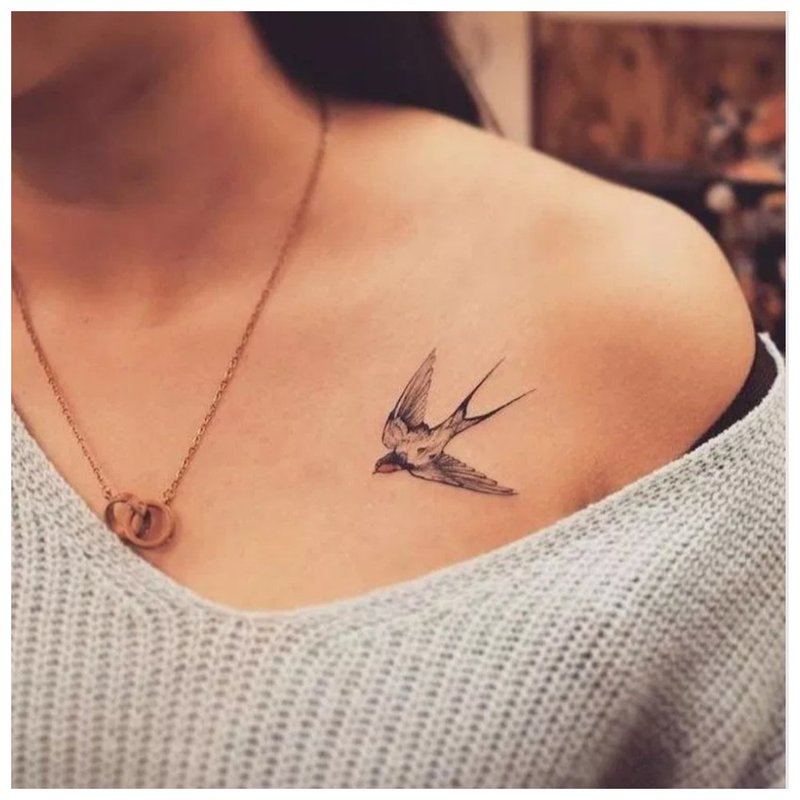 Tender bird collarbone tattoo