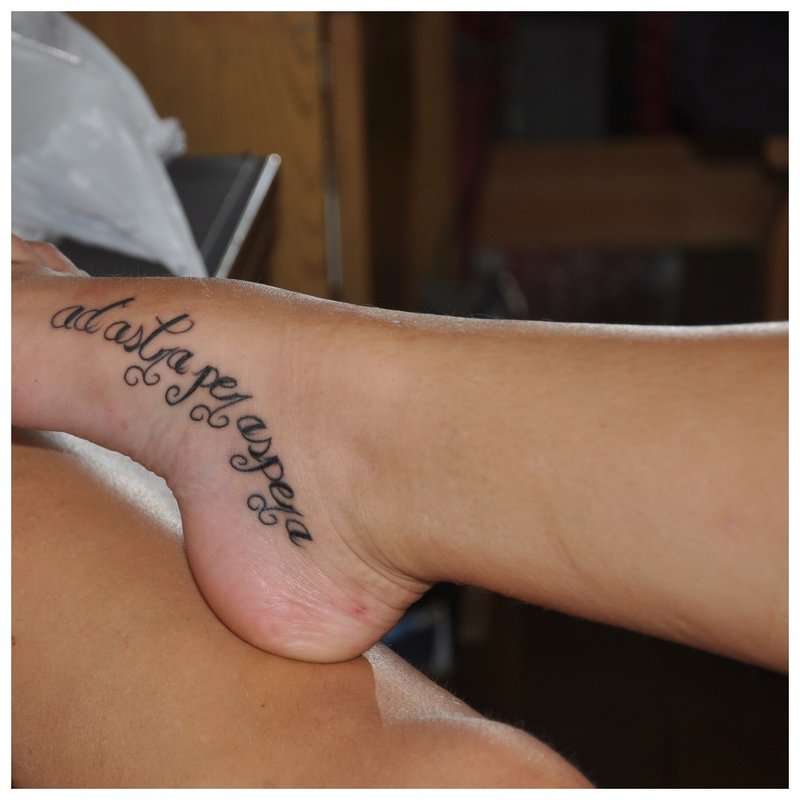 Tattoo inscription on the foot