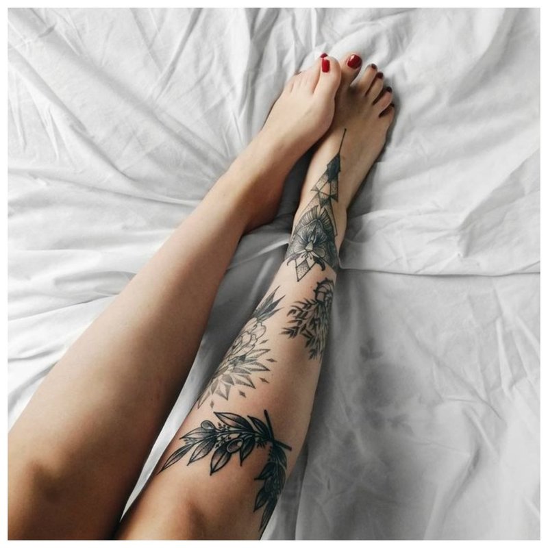 Different tattoos throughout the lower leg