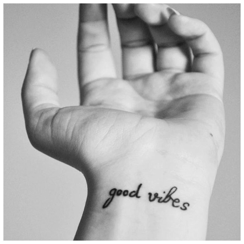 Tattoo inscription in English on the wrist