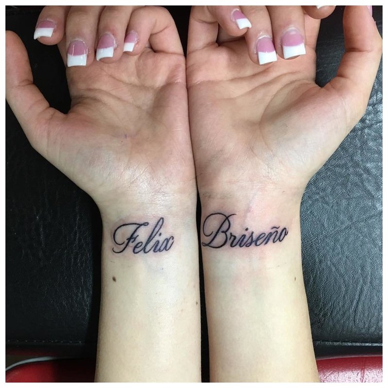 Tattoo inscription on the wrist on both hands