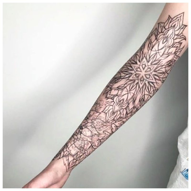 Female full arm tattoo