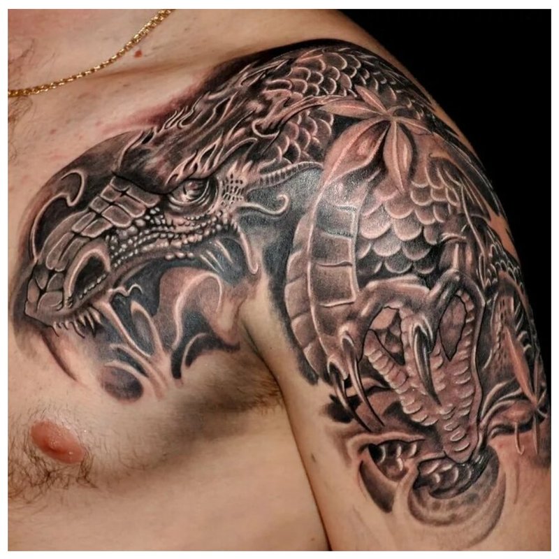 Black and white dragon on the shoulder