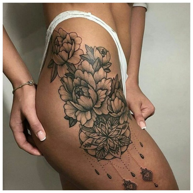 Symbolic hip tattoo