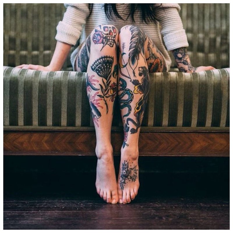 Many different tattoos on the whole leg