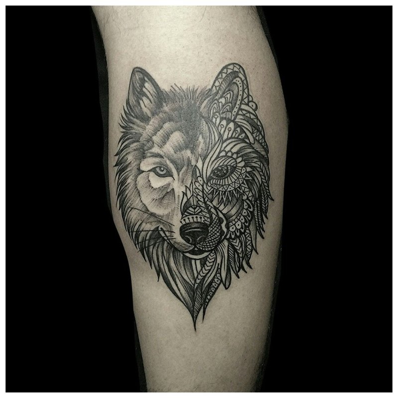 Wolf tattoo in a combined style