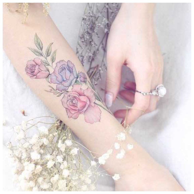 Flower tattoo on the arm of a girl