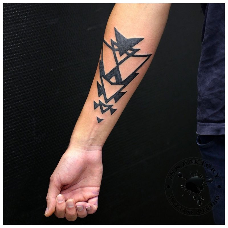 Geometric tattoo on a man's arm