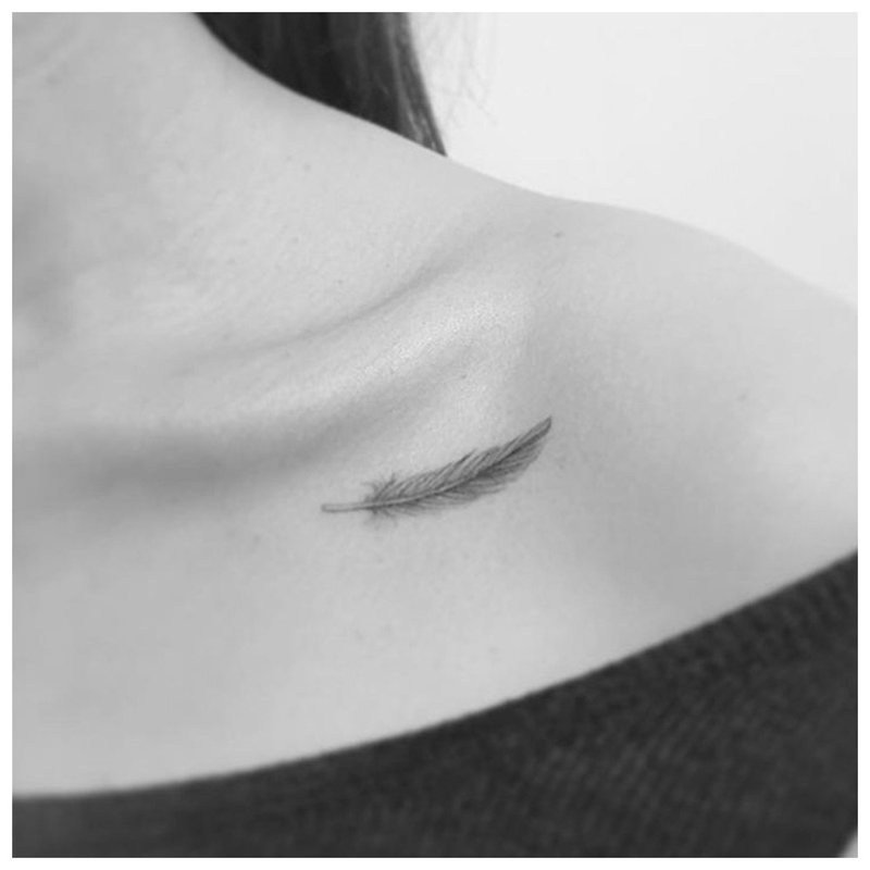 Minimalist feather tattoo