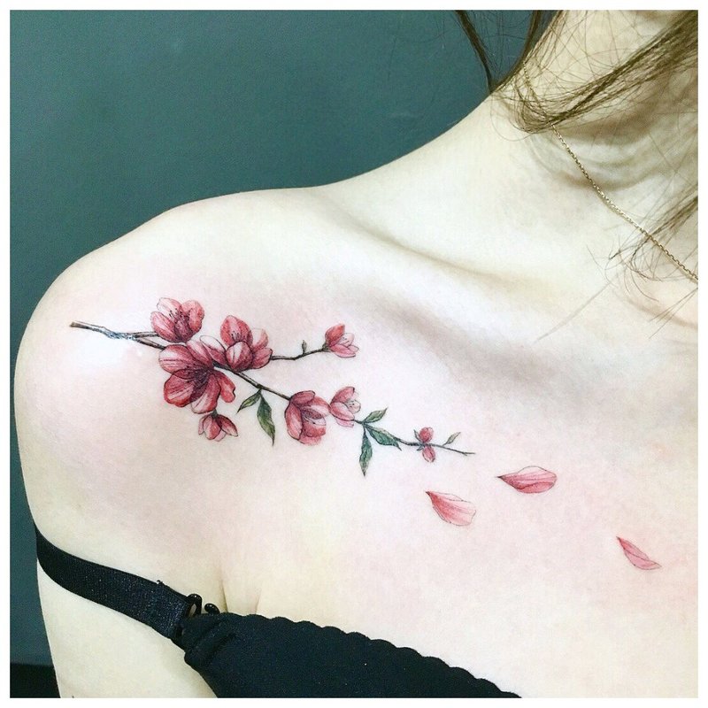 Delicate flower - clavicle tattoo