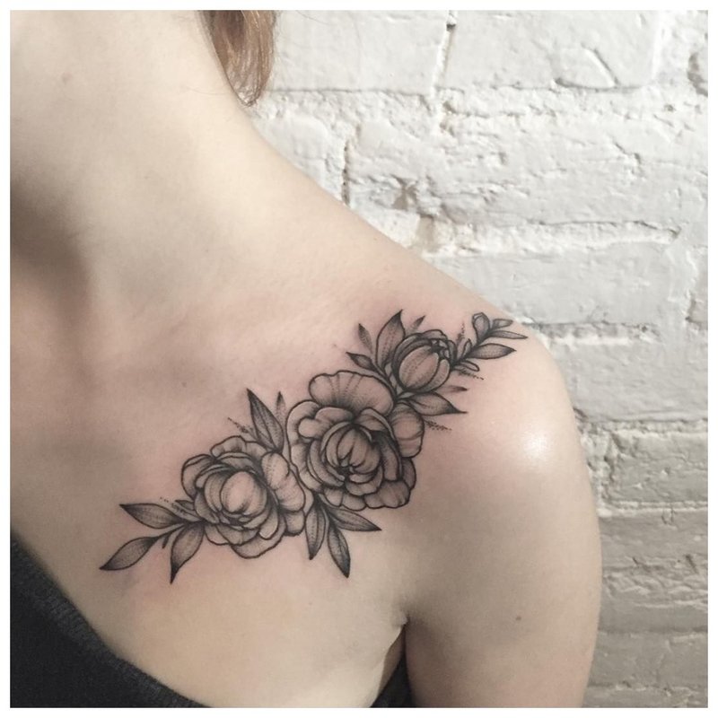 Large dark clavicle tattoo