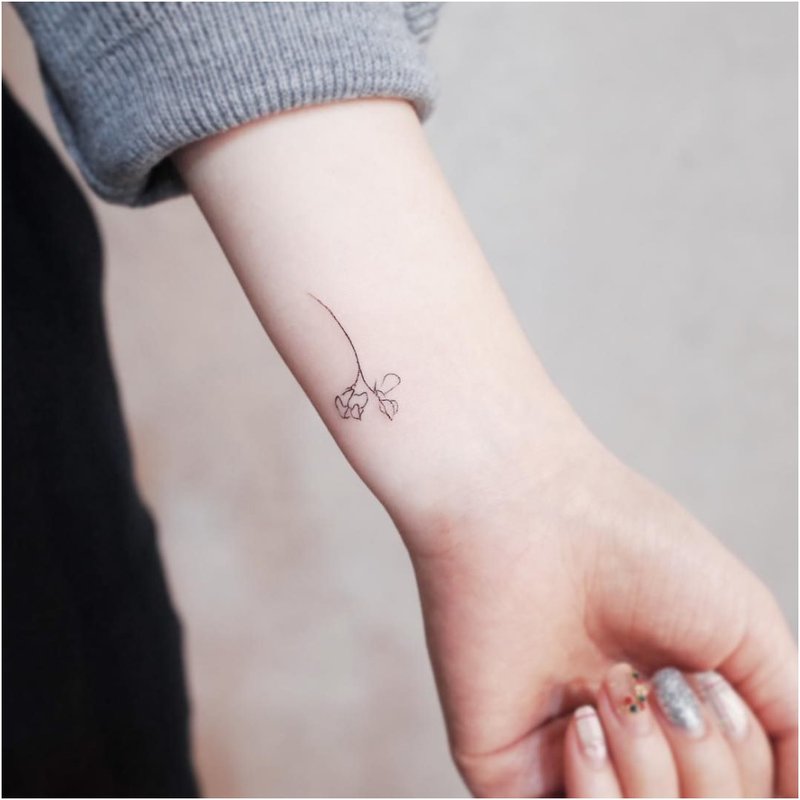 One line flower tattoo