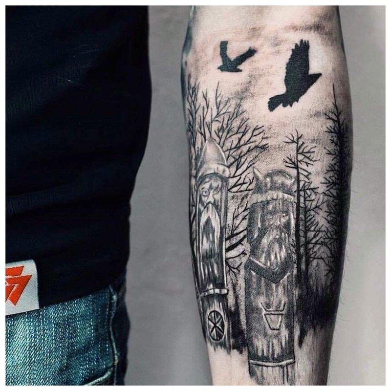 Bird forearm tattoo on men