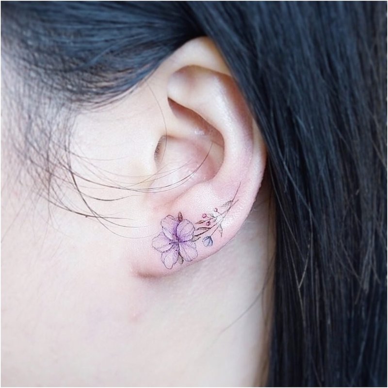 Minimalistic flower on the earlobe