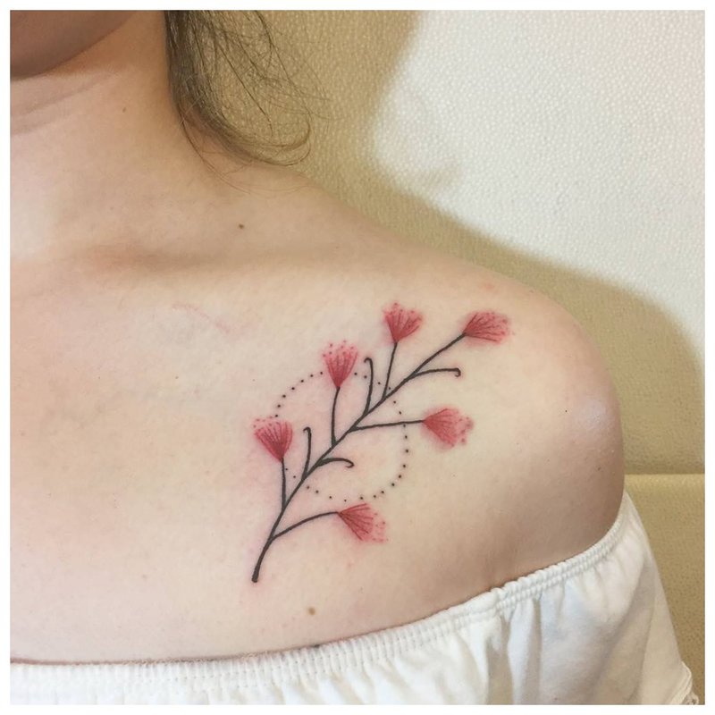 Flower on the collarbone - tattoo girl