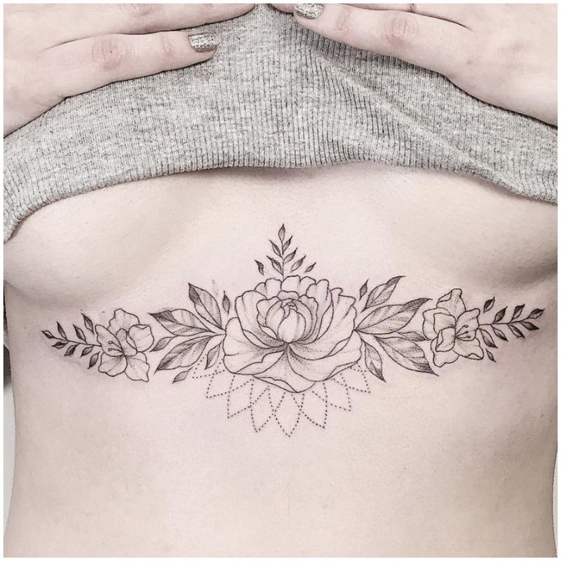 Flower tattoo under the chest