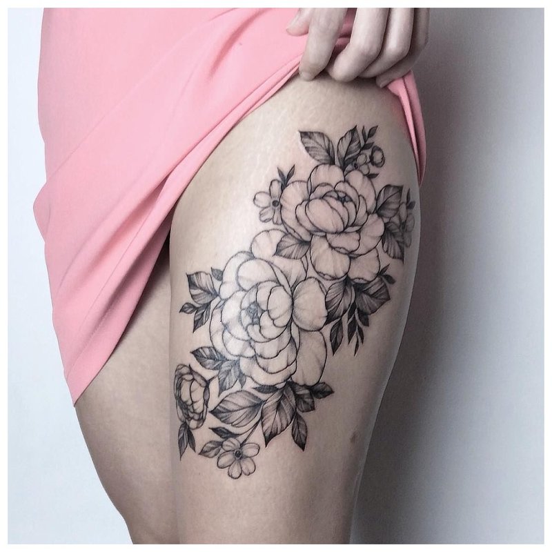 Flower tattoo on the girl's hip