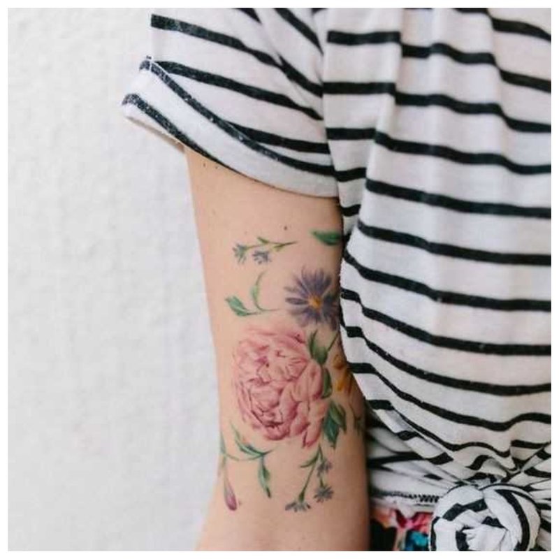 Flower theme tattoo for girl