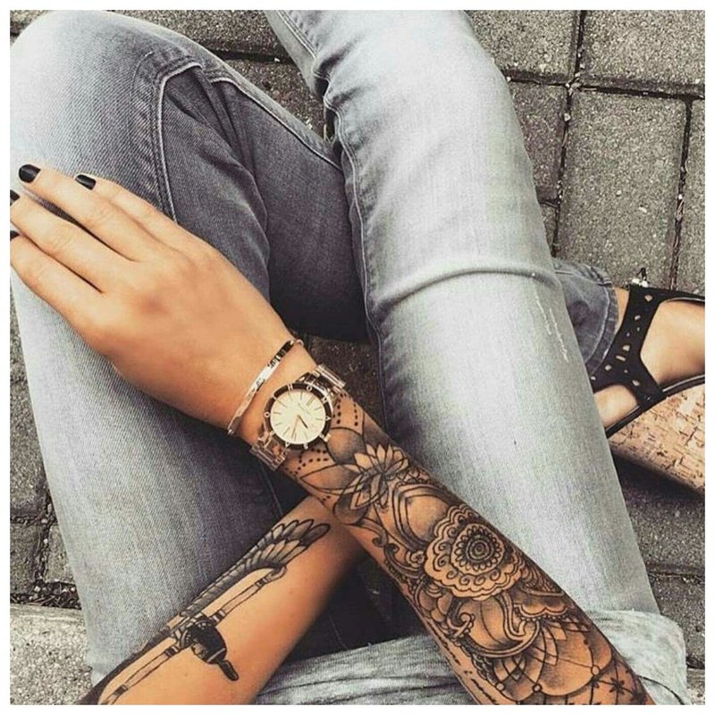 Stylish tattoo on the arm of a girl