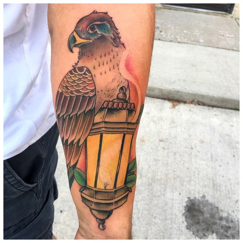 Bird forearm tattoo on men