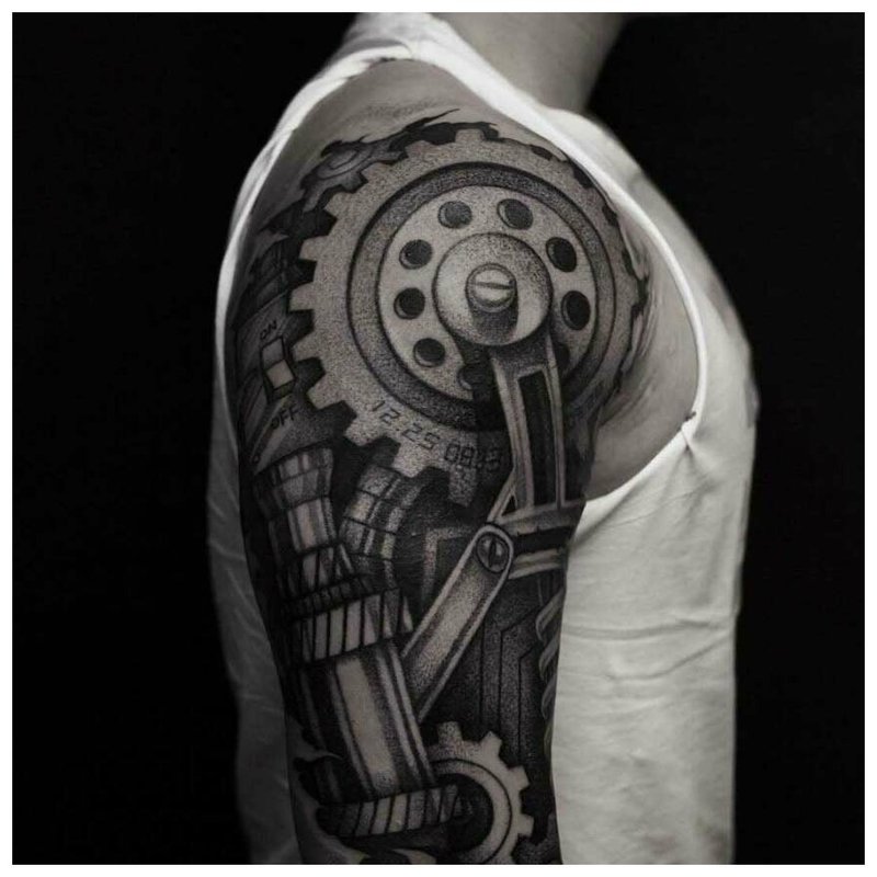 Black and white biomechanics tattoo