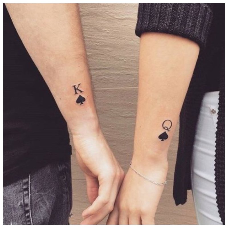 Pair tattoo on arms