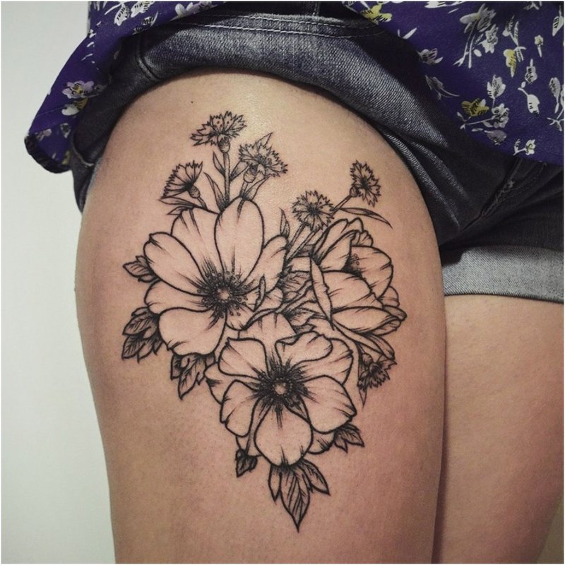 Black and white hip tattoo