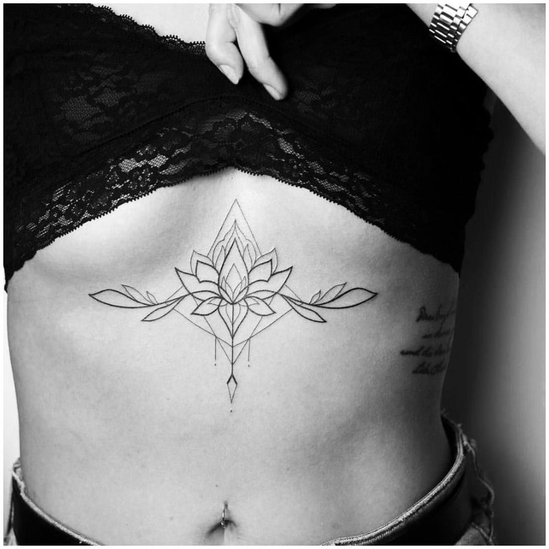 Tender flower tattoo under the chest