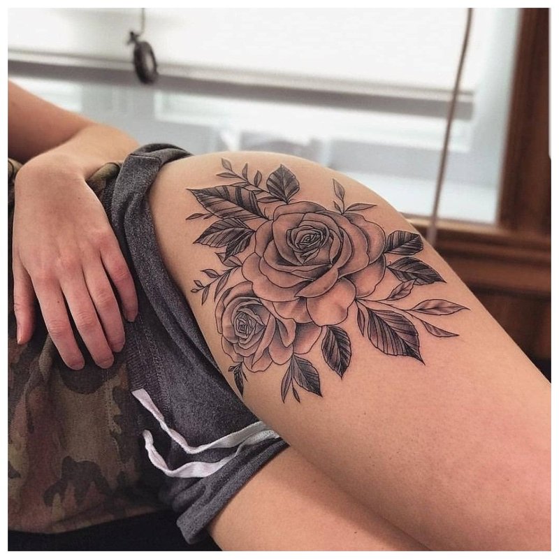 Large flower - a girl's hip tattoo