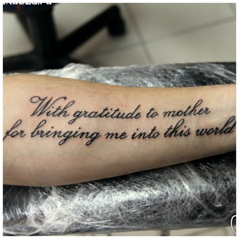 Inscription tattoo on hand