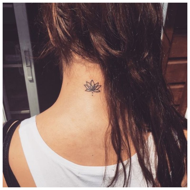 A small tattoo on the body of a girl