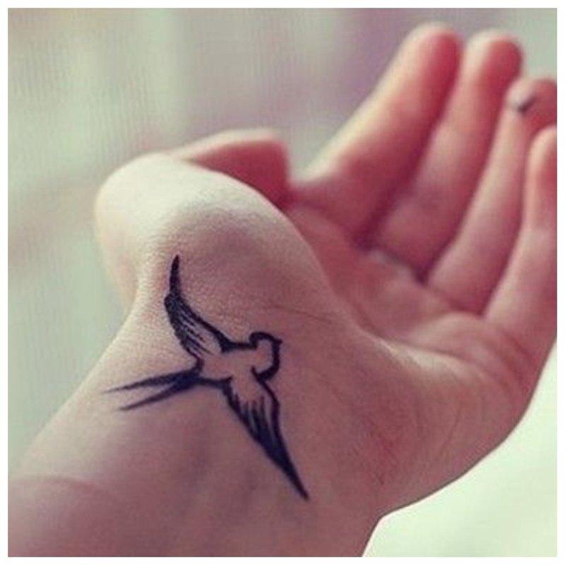 Swallow - tattoo on the wrist