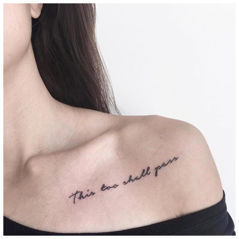 Phrase tattoo on the shoulder