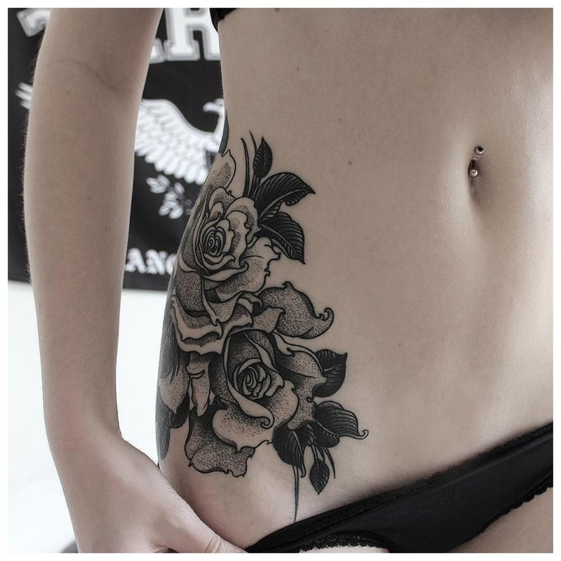 Large floral tattoo on the hip