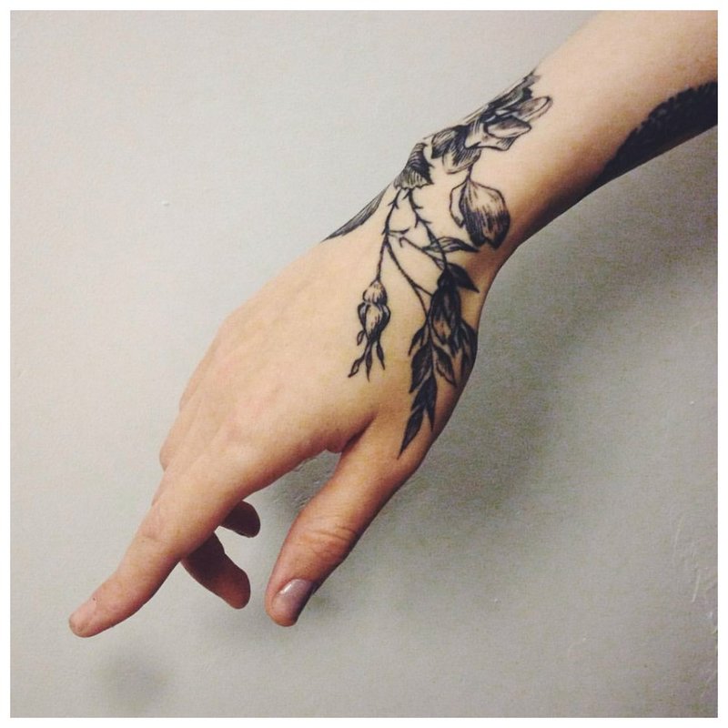 Flowers on hand - tattoo