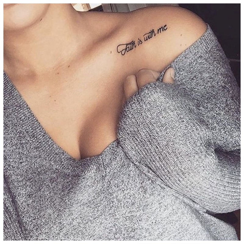 Tattoo in English on the shoulder