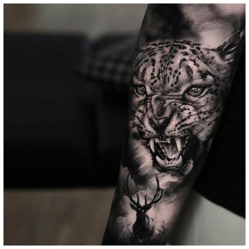 Cheeky man tattoo on the forearm