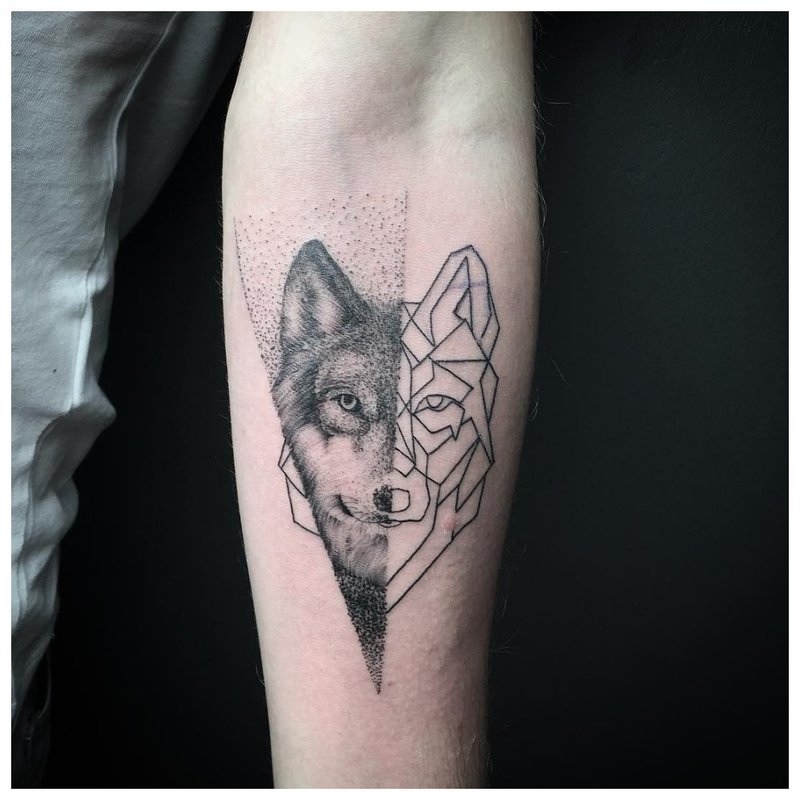 Wolf tattoo in mixed style for a man's hand